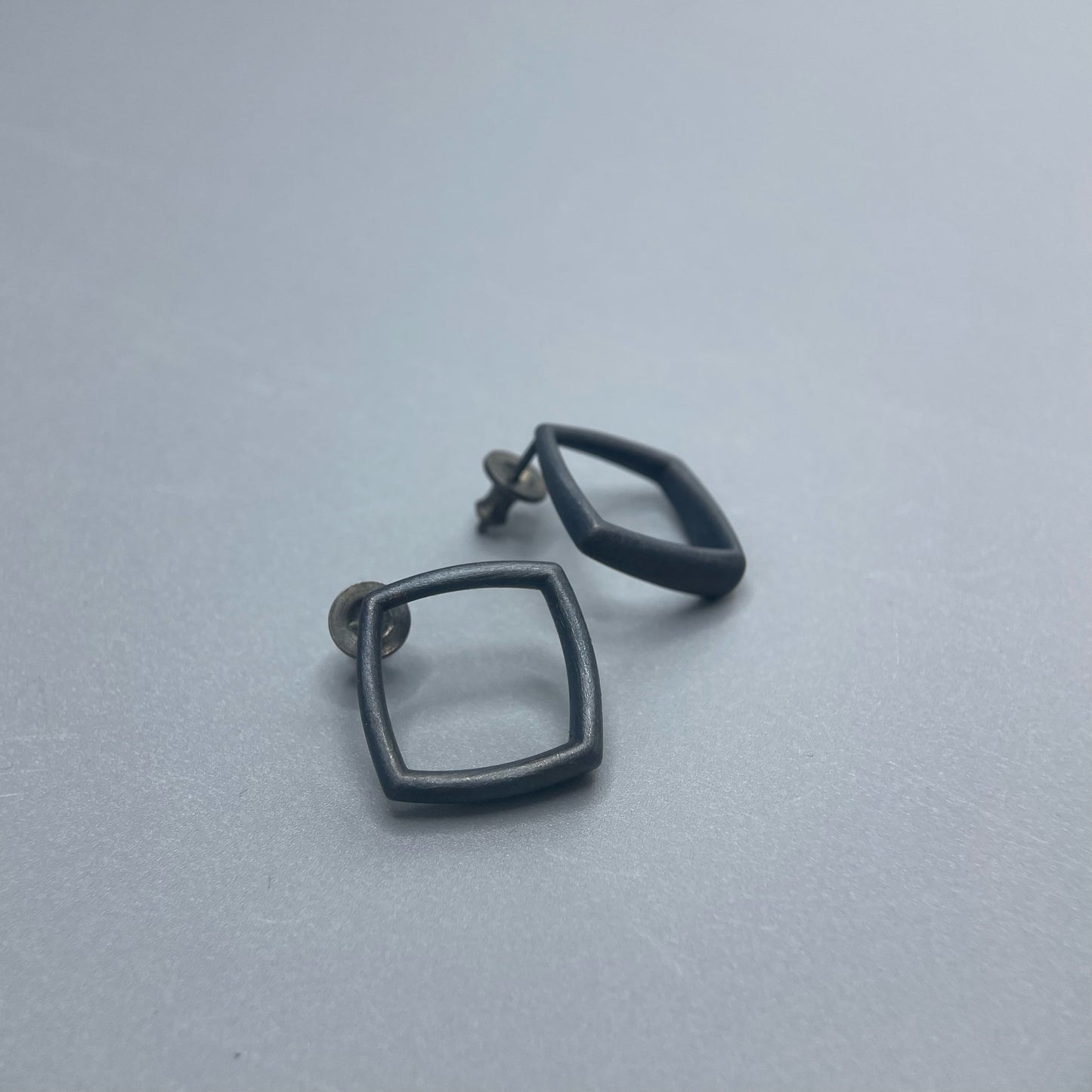 Sheng Zhang - Curved Curves Framed Rhombus Earrings: Oxidised Silver