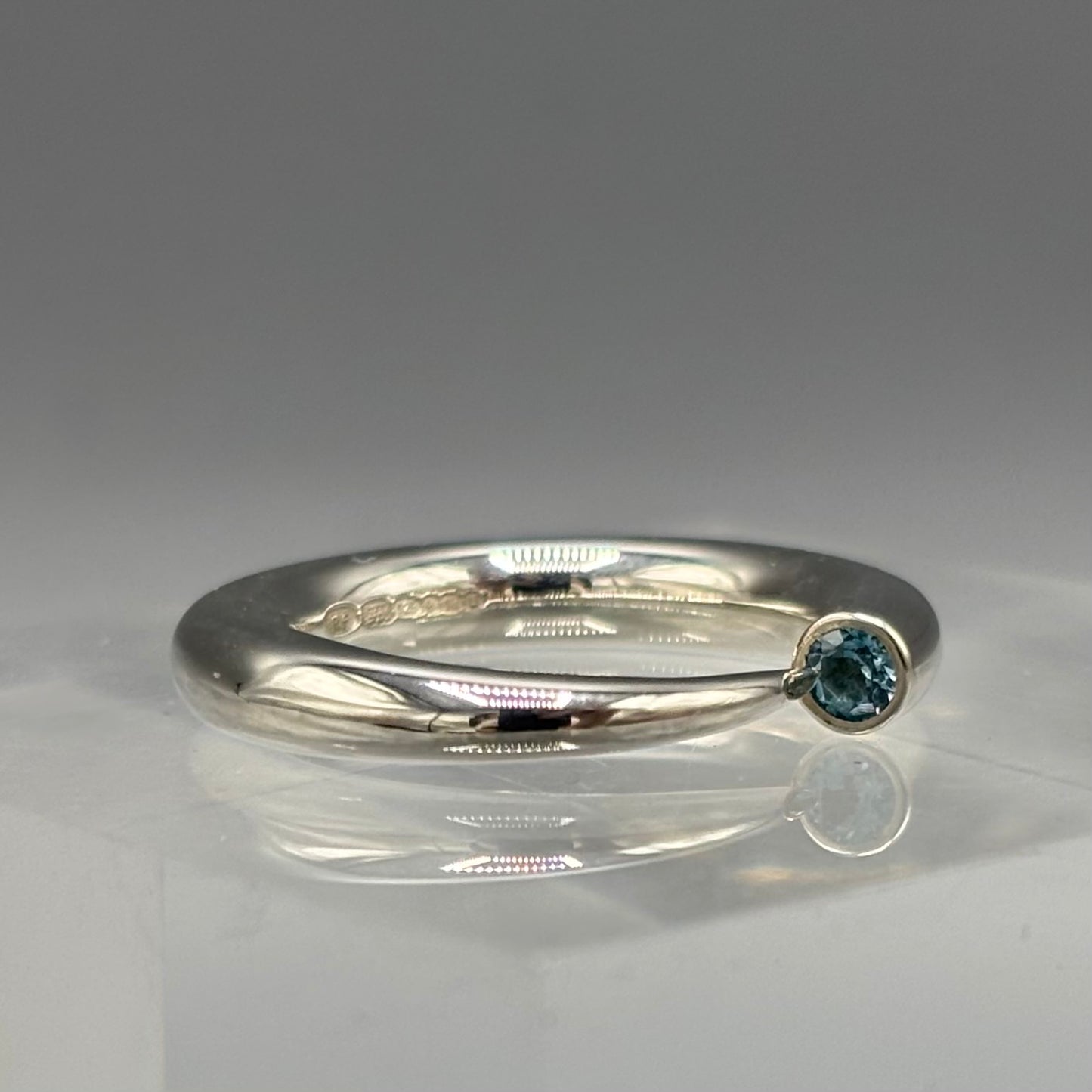 Paul Finch - Ring: 4mm tapering silver with blue topaz
