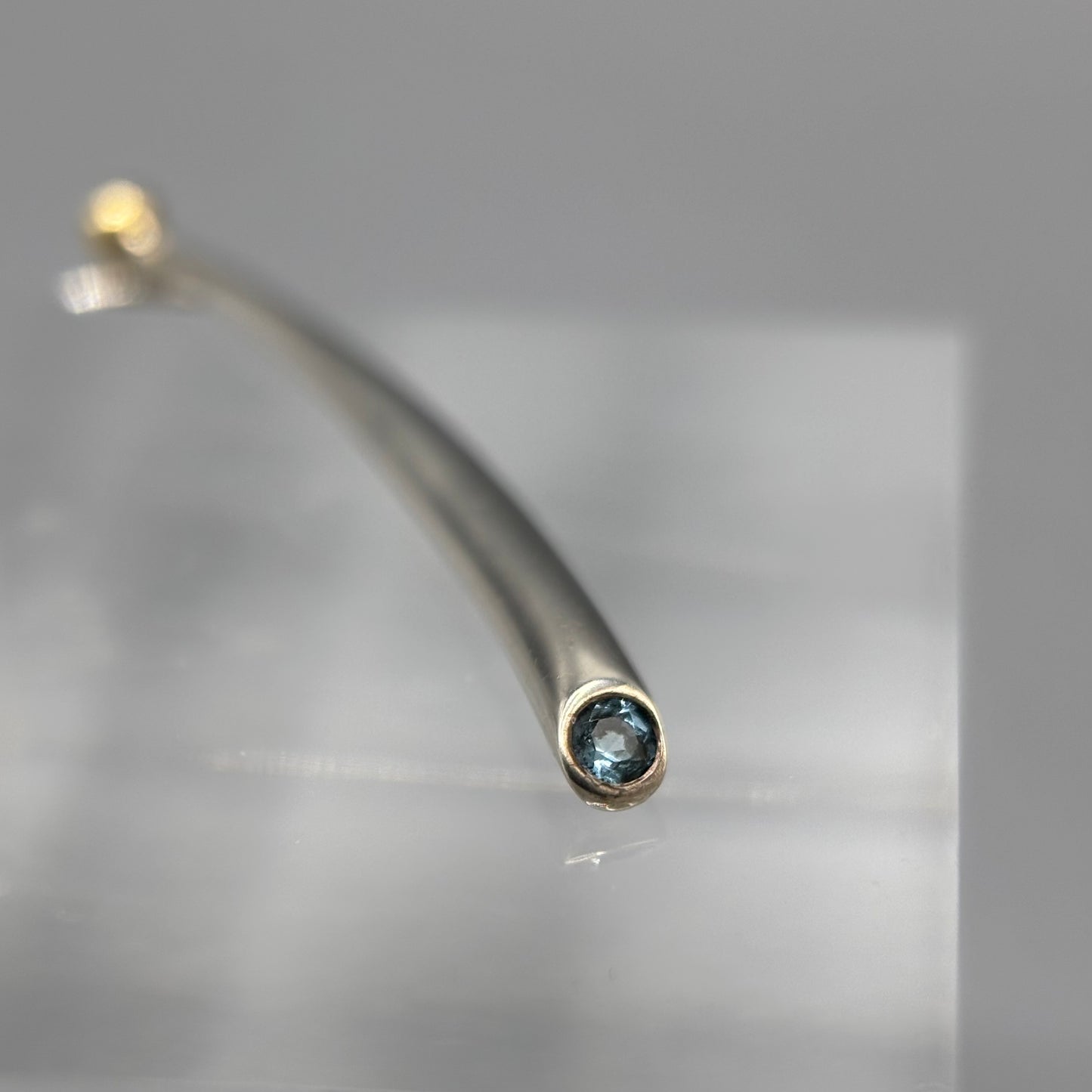 Paul Finch - Pendant: Long curved solid silver/blue topaz & solid 18ct Yellow Gold bead